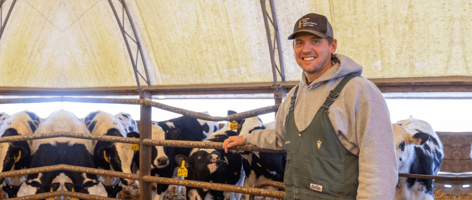 Dr. Thole standing in front of cattle pen