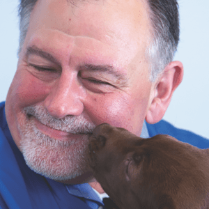 Dr. Revoir with Chocolate Labrador Retriever