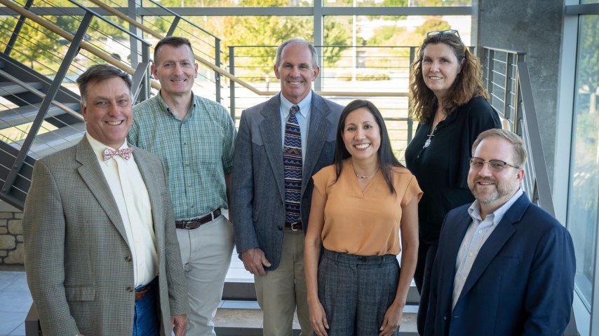 A group of veterinarians stands for a photo.