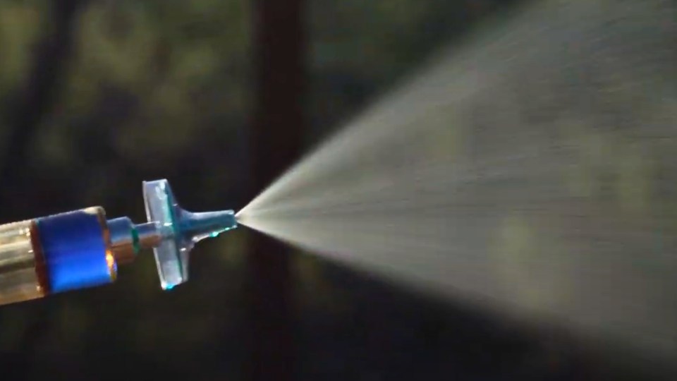 A CleanVax nozzle sprays a liquid.