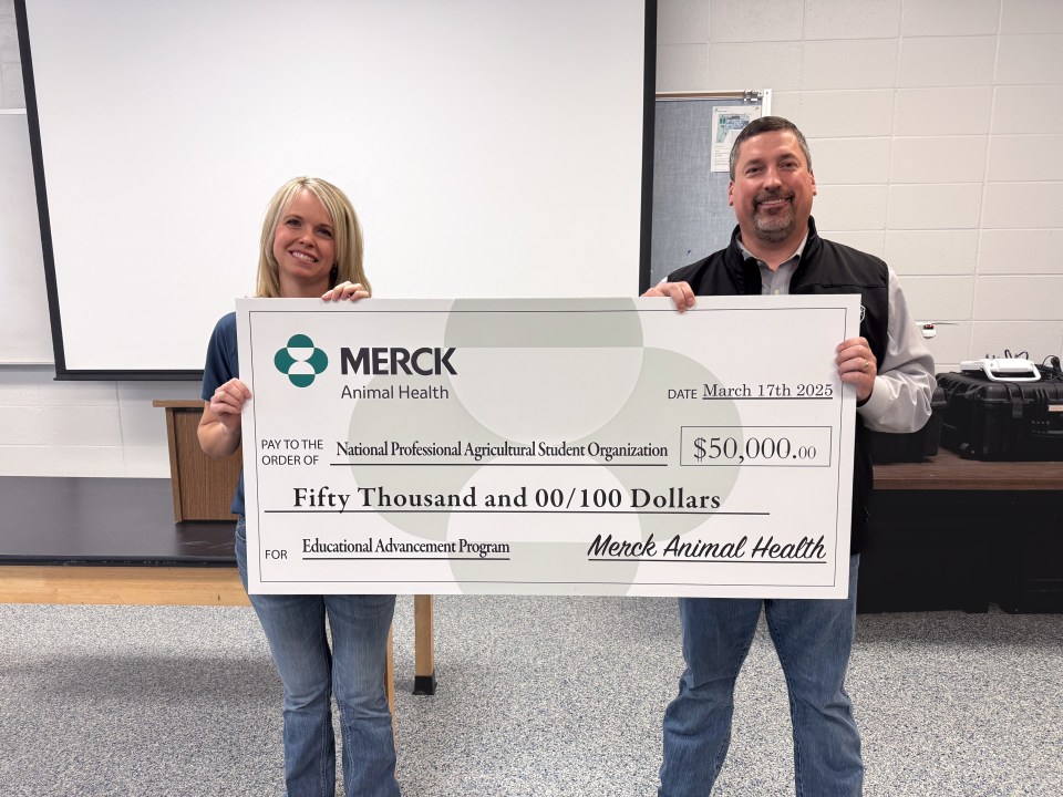 Scott Stehlik, D.V.M., director of swine and poultry technical services for Merck Animal Health, presented a $50,000 donation to Jennifer Bloss, executive director for the National Professional Agricultural Student Organization (PAS), supporting PAS’s new Educational Advancement Program.